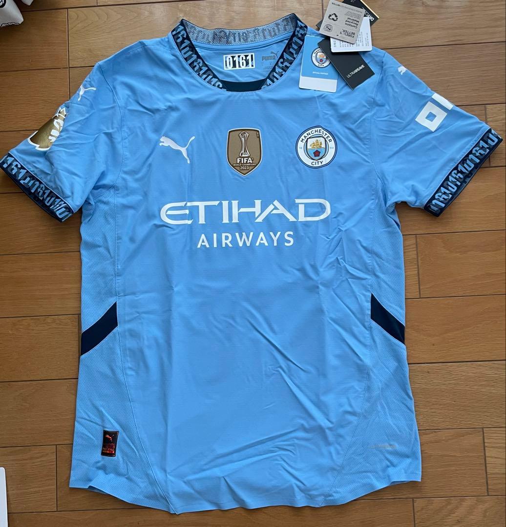 【未使用美品】マンシティ2023-24四連覇優勝記念ウェア　シリアル番号161