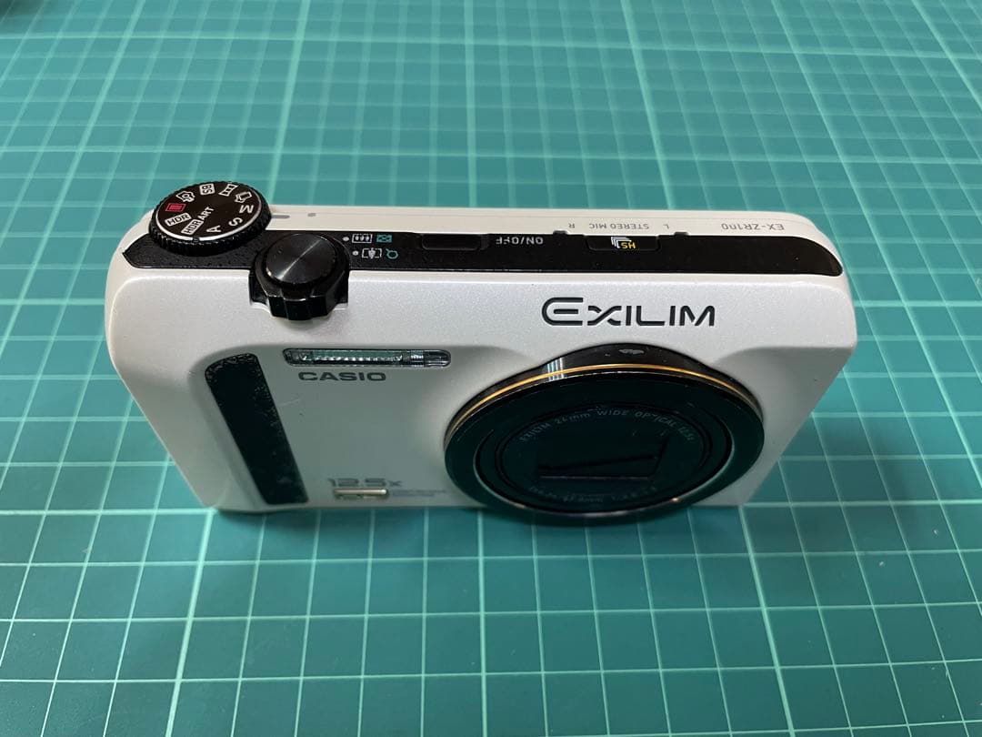 CASIO EXILIM EX-ZR100 ホワイト [電池挿入ふたロック不良]